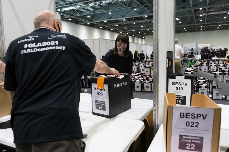 epa09182919 Count staff working at the election count at the ExCel Centre in London, Britain, 07 May 2021. Britons went to the polls on 06 May 2021 to vote in local and mayoral elections. EPA-EFE/VICKIE FLORES