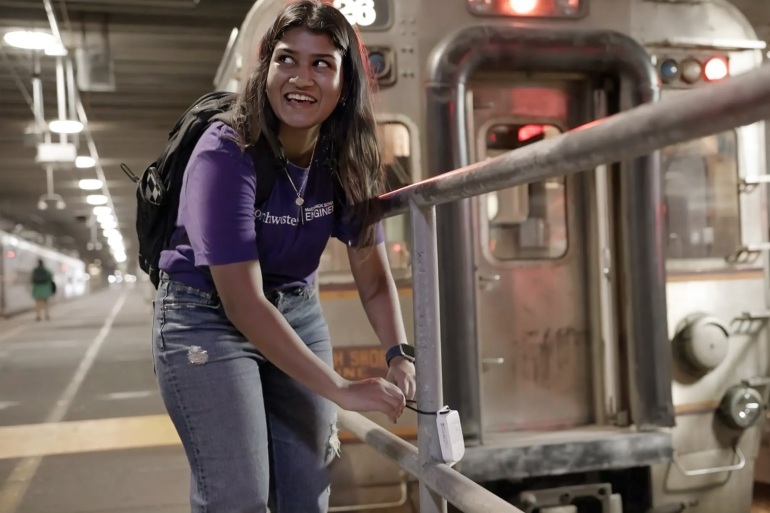 Northwestern Ph.D. student Anjali Naidu Thota affixes a temperature sensor to a pipe in a basement beneath the Chicago Loop. Credit: Northwestern University