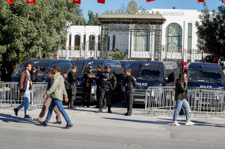 Police officers stand guard outside Tunisia's parliament as the new parliament, elected in December and January in a vote with ultra-low turnout, holds its first session, in Tunis, Tunisia March 13, 2023. REUTERS/Zoubeir Souissi