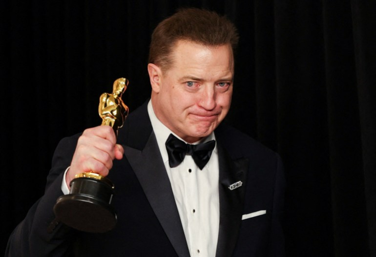 Best Actor Brendan Fraser celebrates with his Oscar backstage at the 95th Academy Awards in Hollywood, Los Angeles, California, U.S., March 12, 2023. REUTERS/Mike Blake TPX IMAGES OF THE DAY