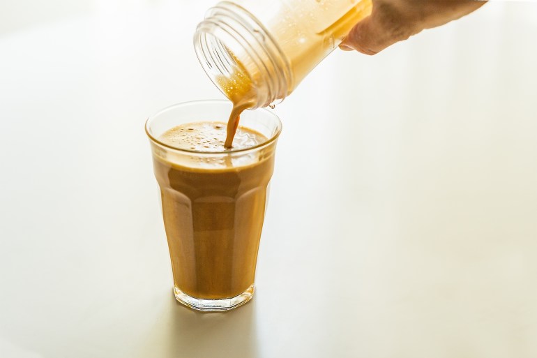 Butter coffee diet. Bulletproof Coffee.Creamy bubble. - stock photo