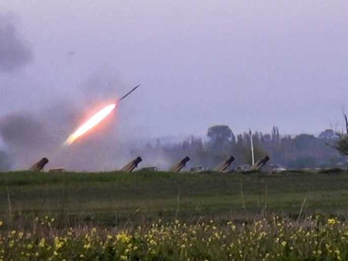 In this image made from video on Sunday, April 3, 2016, a Grad missile is fired by Azerbaijani forces in the village of Gapanli, Azerbaijan. Officials in Azerbaijan and the separatist region of Nagorno-Karabakh say fighting is persisting a day after the worst outburst of hostilities in nearly 20 years killed 30 soldiers. Nagorno-Karabakh, part of Azerbaijan, has been under the control of local ethnic Armenian forces and the Armenian military since a war ended in 1994 with no resolution of the region's status. (AP video via AP)