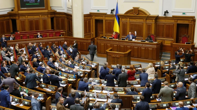 Members of Ukrainian parliament react during a session after voting to consider a draft legislation, proposing to terminate a treaty on ties and cooperation with Russia, in Kiev, Ukraine December 6, 2018. REUTERS/Valentyn Ogirenko