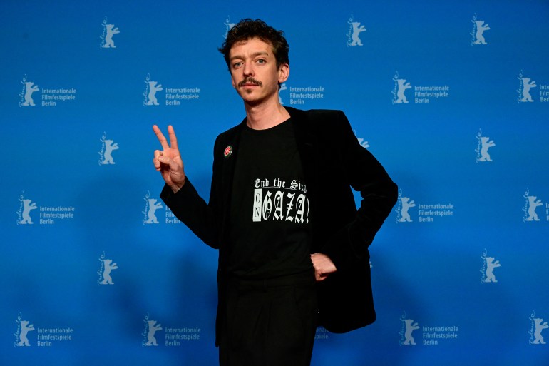 Argentine actor Nahuel Perez Biscayart poses wearing a "End the siege on Gaza" T-shirt during a photo call for the film 'Les gens dà côté' presented in the panorama section at the 74th Berlinale, Europe's first major film festival of the year, in Berlin on February 19, 2024. (Photo by John MACDOUGALL / AFP)