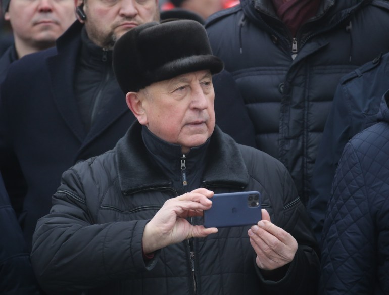 MOSCOW, RUSSIA - FEBRUARY 23 (RUSSIA OUT) Russian Communist Party's Candidate for 2024 Presidential Elections Nikolay Kharitonov holds his iPhone during a flowers laying ceremony at the Hero City Stalingrad monument, marking the Defender of the Fatherland's Day, February,23 2024, in Moscow, Russia. Defender of the Fatherland Day was formerly known as Soviet Army Day and celebrates the armed forces and commemorates the founding the Red Army. (Photo by Contributor/Getty Images)