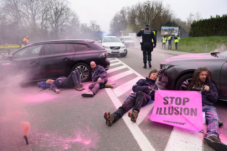 Environmental activists, including Greenpeace, hold a protest on the day of an IAEA Nuclear Energy Summit in Brussels, Belgium, March 21, 2024. REUTERS/Johanna Geron