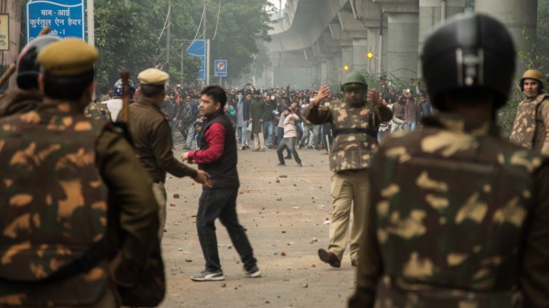 Protest Against Citizenship Amendment Bill turned violent in Delhi- - DELHI, INDIA - DECEMBER 13: Protest against controversial citizenship amendement bill turned violent when Delhi Police shot tear gas and beaten the students of Jamia Millia Islamia University in Delhi, India on Decemeber 13, 2019. The citizenship amendement bill which was passed in the parliament allows Hindus from Afghanistan, Bangladesh and Pakistan to get citizenship and exclude Muslim in India.