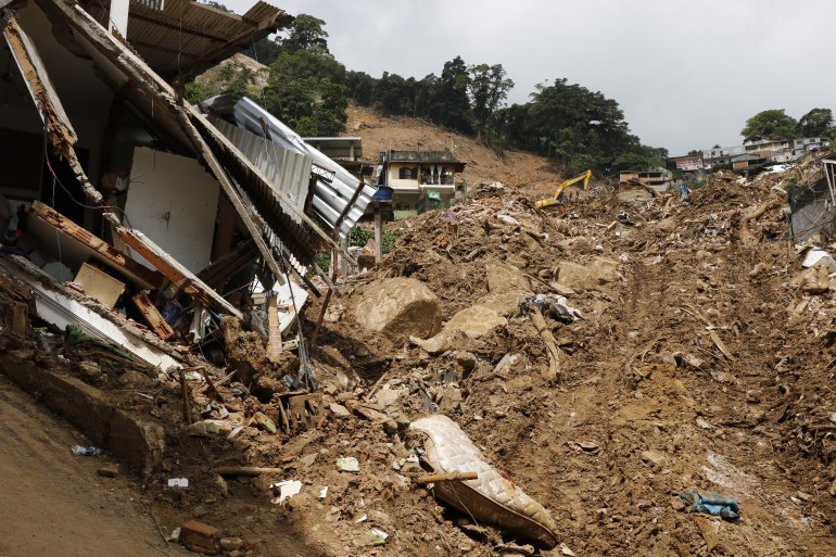 Landslide in Petropolis city, natural disaster destroyed house, mud and debris. Firefighters teams working search and rescue for victims of rain at Morro da Oficina. Rio de Janeiro, Brazil 02.25.2022