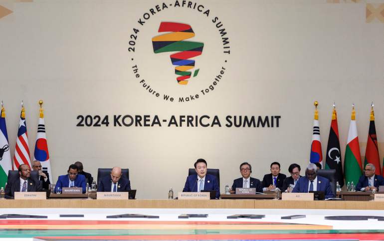 This handout picture taken on June 4, 2024 and released by 2024 Korea-Africa Summit and Yonhap News shows South Korean President Yoon Suk Yeol (C) delivering an opening speech during the 2024 Korea-Africa Summit in Goyang. President Yoon Suk Yeol on June 4 announced billions of dollars in new aid and investment support for Africa, as South Korea looks to boost trade ties with the continent. - RESTRICTED TO EDITORIAL USE - MANDATORY CREDIT "AFP PHOTO / 2024 Korea-Africa Summit and Yonhap News " - NO MARKETING NO ADVERTISING CAMPAIGNS - DISTRIBUTED AS A SERVICE TO CLIENTS - NO ARCHIVE (Photo by Handout / 2024 KOREA-AFRICA SUMMIT AND YONHAP NEWS / AFP) / RESTRICTED TO EDITORIAL USE - MANDATORY CREDIT "AFP PHOTO / 2024 Korea-Africa Summit and Yonhap News " - NO MARKETING NO ADVERTISING CAMPAIGNS - DISTRIBUTED AS A SERVICE TO CLIENTS - NO ARCHIVE