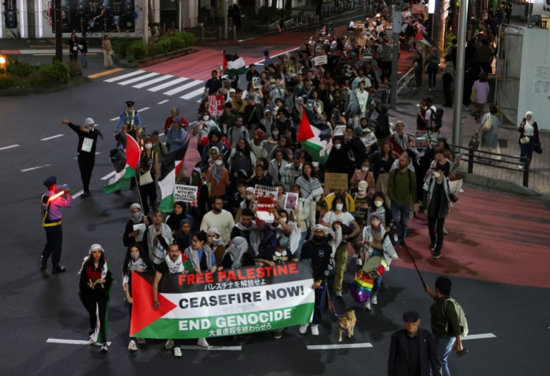 Pro-Palestinian people take part in a protest march called 'The Intifada March" calling for an immediate ceasefire in Gaza, amid the ongoing conflict between Israel and the Palestinian Islamist group Hamas, in Tokyo, Japan May 11, 2024. REUTERS/Irene Wang