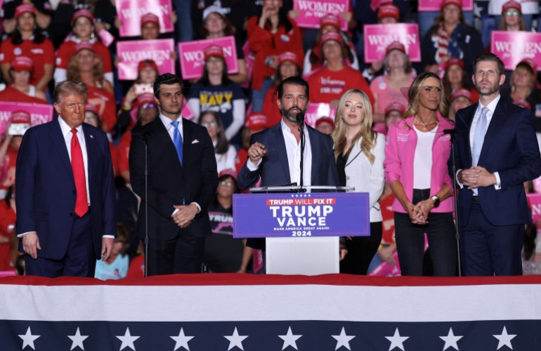 Donald Trump Jr. speaks next to Eric Trump, Tiffany Trump and Lara Trump during a campaign rally for Republican presidential nominee former U.S. President Donald Trump at Santander Arena in Reading, Pennsylvania, U.S., November 4, 2024. REUTERS/Andrew Kelly