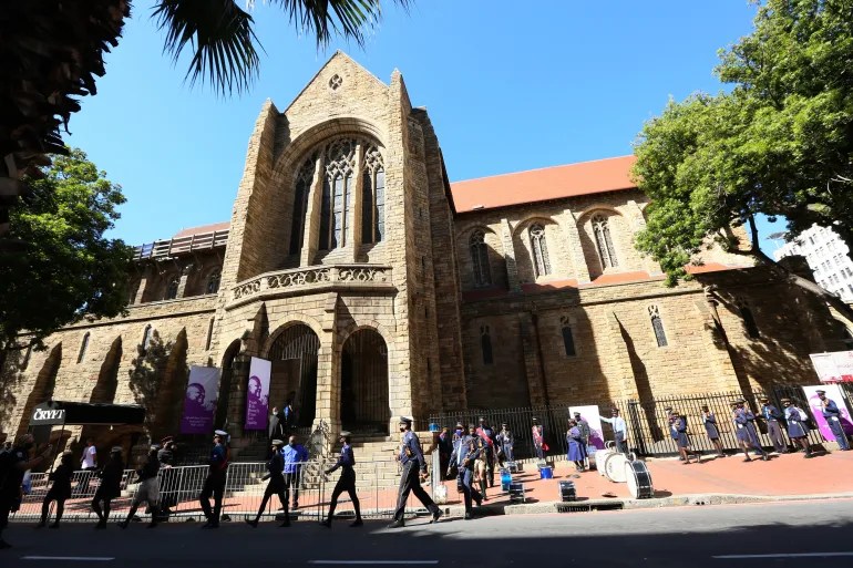 People queue to pay their respects to the late Anglican Archbishop Emeritus Desmond Tutu at St George’s Cathedral, in December 2021 [File: Tsvangirayi Mukwazhi/AP]