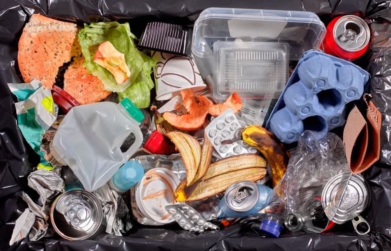 Rubbish in bin unsorted - stock photo