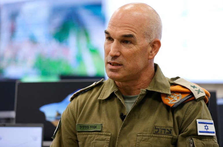 Major General Ori Gordin, chief of Israel's Home Front Command, speaks during an interview with AFP at the command's operational centre in the central town of Ramle, on October 12, 2021. Israel does not want a war with the Lebanese Hezbollah but is preparing to receive a record of some 2,000 rockets per day if an armed conflict breaks out between the two camps, Gordin told AFP. (Photo by JACK GUEZ / AFP)