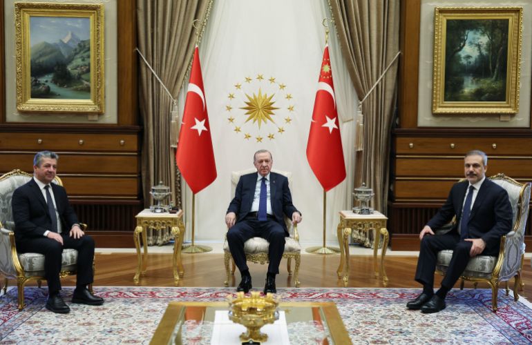 This handout photograph taken and released by Turkish Presidency Press Office on January 7, 2025, shows Turkey's President Recep Tayyip Erdogan (C) posing with Prime minister of Iraq's autonomous Kurdistan Region Masrour Barzani (L) and Turkish Foreign minister Hakan Fidan (R) prior to their meeting at the Presidential Complex in Ankara. (Photo by HANDDOUT / Turkish Presidency Press Office / AFP) / RESTRICTED TO EDITORIAL USE - MANDATORY CREDIT "AFP PHOTO / TURKISH PRESIDENCY PRESS OFFICE" - NO MARKETING NO ADVERTISING CAMPAIGNS - DISTRIBUTED AS A SERVICE TO CLIENTS