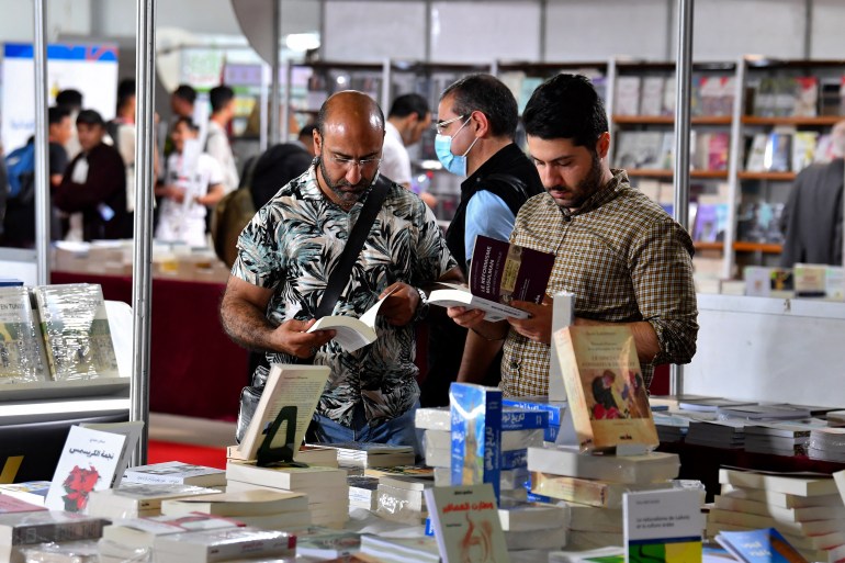 People visit the 37th Tunis International Book Fair in the Tunisian capital on April 29, 2023. The Tunisian president preached freedom of thought at the fair on April 28, shortly before authorities confiscated a book comparing him to Frankenstein, the publisher said. (Photo by FETHI BELAID / AFP)