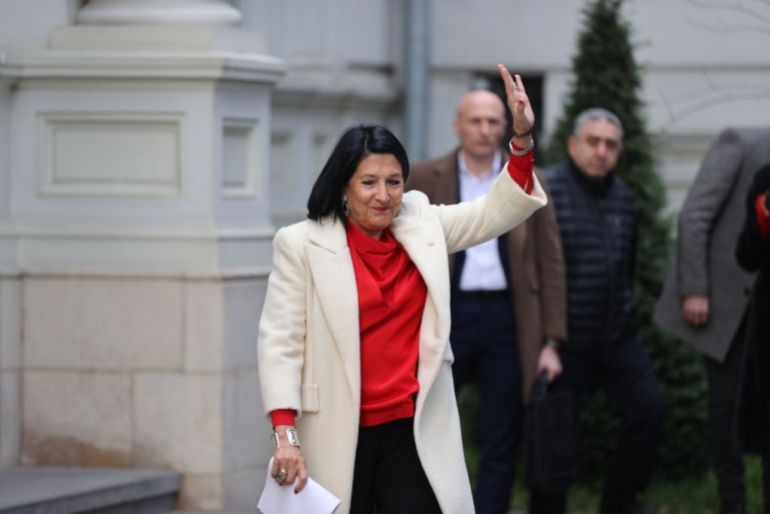 TBILISI, GEORGIA - 2024/12/29: Former President Salome Zourabichvili greets a supporter outside her residence in Tbilisi, following the inauguration of the newly elected president, Mikheil Kavelashvili, whose legitimacy is contested by Zourabichvili and opposition parties. The former president called the parliamentary elections on the 28th of October and the subsequent election of a new president, former football player Mikheil Kavelashvili, illegitimate and unconstitutional, as the ruling party cannot enact such power while under investigation for allegations of election rigging. Today, Kavelashvili was inaugurated by the ruling Georgian Dream party and Zourabichvili has ceded her office. She still does not recognise the authority of the party or the new president, saying that legitimacy can only be recognised by the people. (Photo by Jay Kogler/SOPA Images/LightRocket via Getty Images)