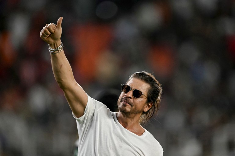 Bollywood actor and co-owner of Kolkata Knight Riders' team Shah Rukh Khan greets fans after their team's win against Sunrisers Hyderabad at the end of their Indian Premier League (IPL) Twenty20 first qualifier cricket match in the Narendra Modi Stadium of Ahmedabad on May 21, 2024. (Photo by Punit PARANJPE / AFP) / -- IMAGE RESTRICTED TO EDITORIAL USE - STRICTLY NO COMMERCIAL USE --