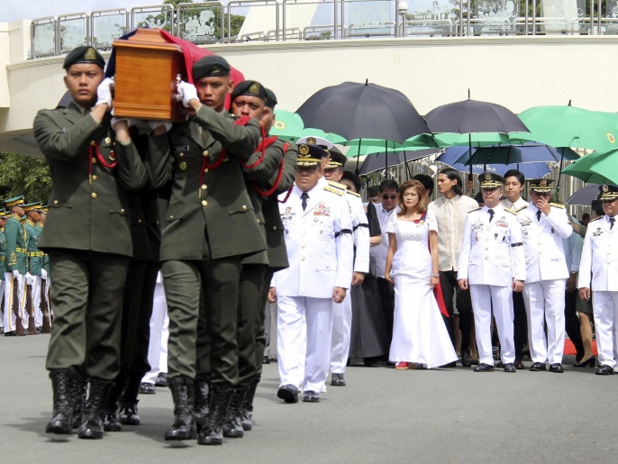 A handout picture dated and released on 18 November 2016 by the Office of the Army Chief Public Affairs Headquarters Philippine Army (OACPA HPA) shows Filipino soldiers carrying the flag-draped casket of the late Philippine dictator Ferdinand Marcos during burial rites at the Heroes' Cemetery in Pasay City, south of Manila, Philippines. Former Philippine dictator Ferdinand Marcos was buried at the Heroes' Cemetery in a controversial and unexpected ceremony, which was