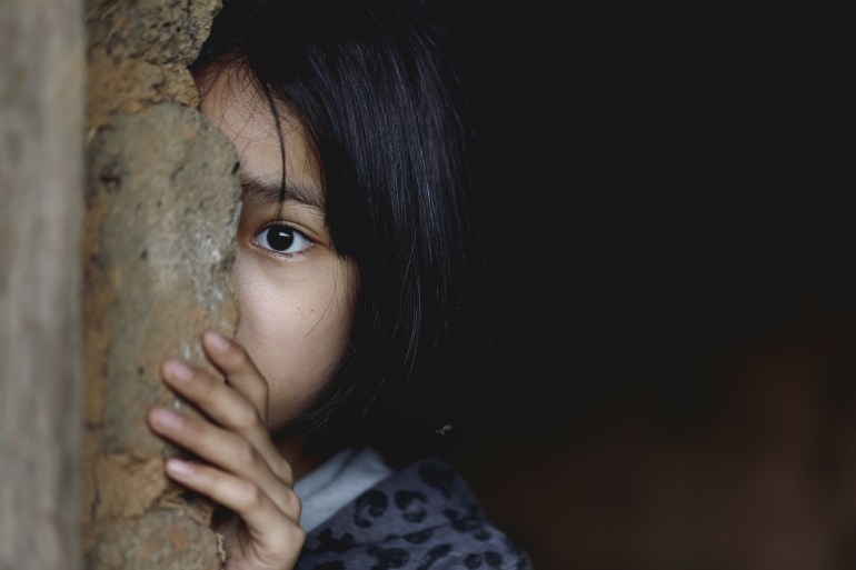 Little girl with eye sad and hopeless. Human trafficking and fear child concept.