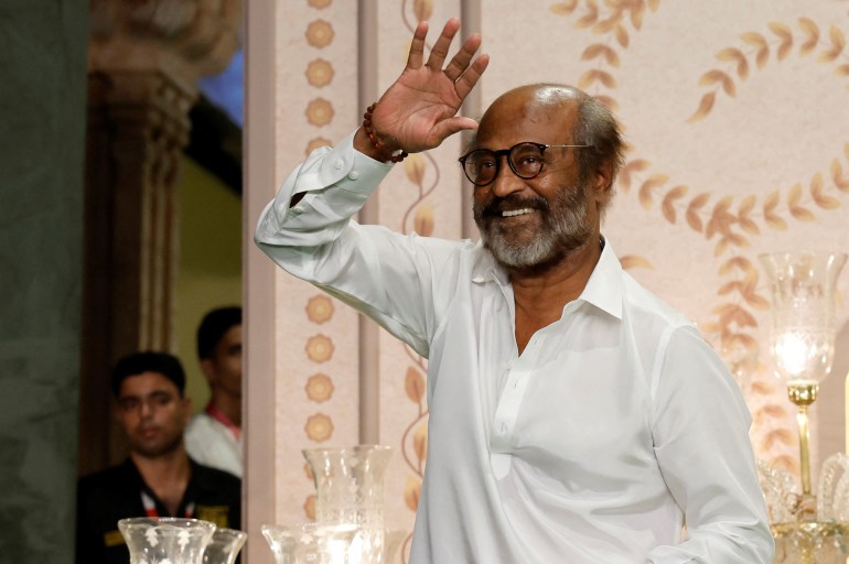 Indian actor Rajinikanth poses for pictures on the red carpet as he attends the blessing ceremony of Anant Ambani and Radhika Merchant after their marriage in Mumbai, India, July 13, 2024. REUTERS/Francis Mascarenhas