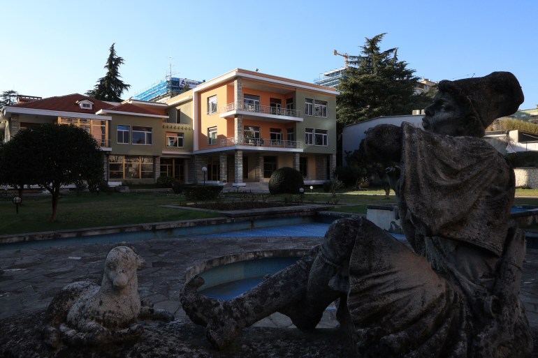 The sculpture of a young pastor in folk costume adorns the courtyard of the the villa of former Albanian communist dictator Enver Hoxha in Tirana on February 5, 2025. In the middle of Albania's capital, the villa of its former dictator is set to welcome young artists from around the world, marking the latest step in the country's transition from its hermetic past to a rapidly evolving future. (Photo by Adnan Beci / AFP)