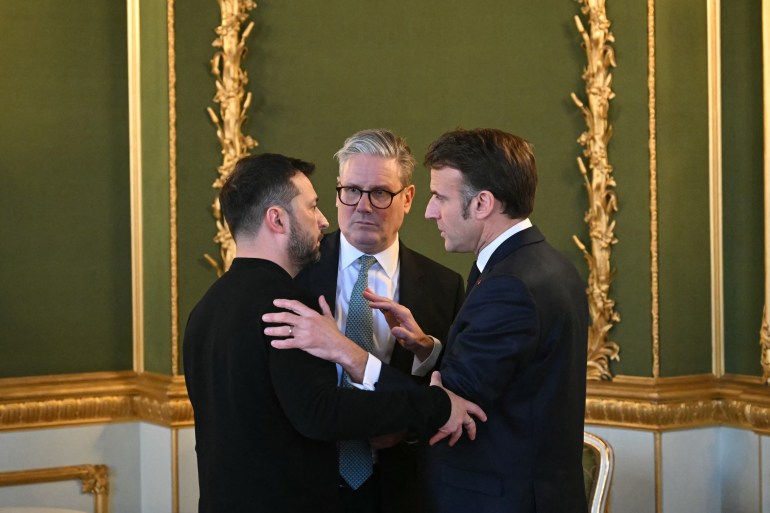 (L-R) Ukraine's President Volodymyr Zelensky, Britain's Prime Minister Keir Starmer and France's President Emmanuel Macron embrace after holding a meeting during a summit at Lancaster House in central London on March 2, 2025. European leaders descend upon London today for talks to "drive forward" action on Ukraine, according to the office of UK Prime Minister Keir Starmer. The summit caps off a week of intense diplomacy for host Starmer, who met with President Donald Trump on Thursday in an effort to draw together the European and US approaches to the Ukraine conflict. (Photo by JUSTIN TALLIS / POOL / AFP)