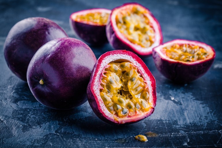 ripe organic passion fruit on dark background المصدر: أدوبي ستوك