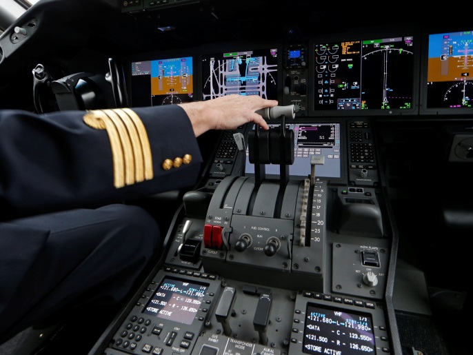An Air France pilot stands in the cockpit of the airline's new Boeing Inc. 787-9 Dreamliner passenger aircraft as it stands on the tarmac at Charles de Gaulle Airport in Roissy, France, December 2, 2016. REUTERS/Benoit Tessier