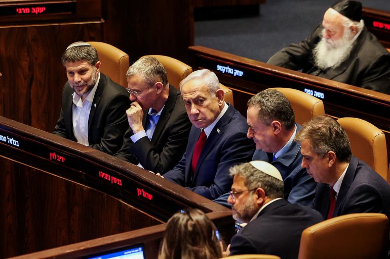 Israeli Prime Minister Benjamin Netanyahu, Finance Minister Bezalel Smotrich, Defense Minister Israel Katz and National Security Minister Itamar Ben-Gvir attend a discussion at the plenum in the Knesset, Israel's parliament, in Jerusalem, July 23, 2025. REUTERS/Ronen Zvulun