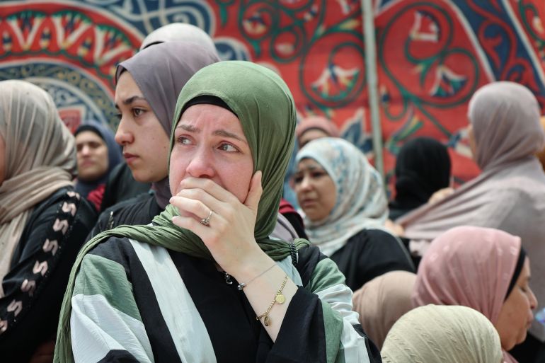 صورة 1- فلسطين - رام الله- عزيزة نوفل- من وداع شهداء المزرعة الشرقية- الجزيرة
