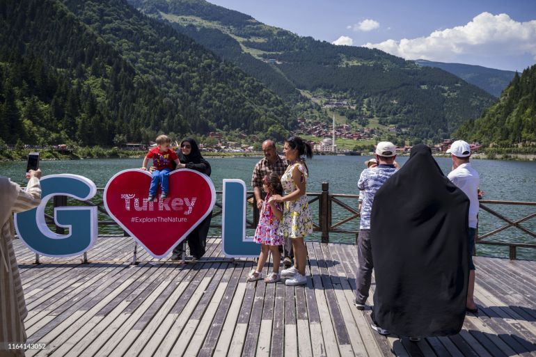 Tourists paddle in a lake at Uzungol, Trabzon, Turkey on Thursday, Aug. 15, 2019. The relaxed cordiality between pious Saudis and their Turkish hosts masks a power struggle between the two Sunni Muslim rivals as Turkey tries to gain greater influence in the Arab world. Photographer: Kerem Uzel/Bloomberg via Getty Images